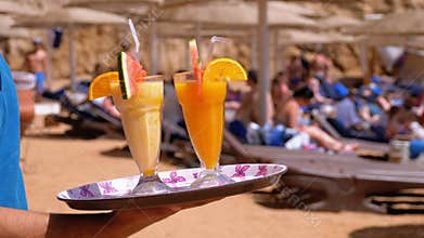 Exotic Cocktails in a Glass with a Straw on a Tray on the Background of the Sea. Egypt.