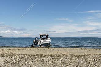 VICTORIA, CANADA - JULY 13, 2019: Stabicraft's aluminium power boat with wheels on the beach