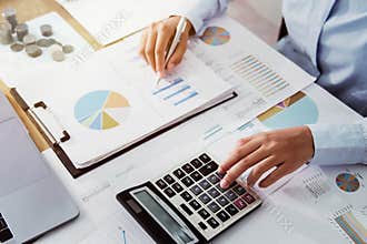 .Business woman working in finance and accounting Analyze financial budget in the office