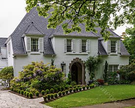 VANCOUVER, CANADA - MAY 15, 2019: Beautiful house with nicely trimmed green street view