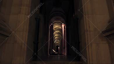 Tilt up shot of arch of Cafe Marly in Paris in night
