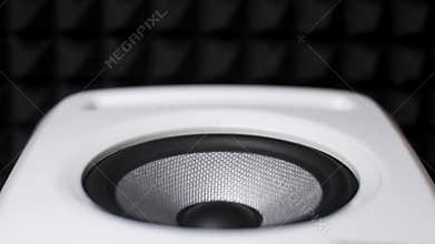 Close of Stereo System with Bass playing Music