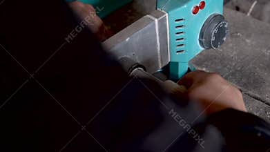 Close up hands soldering metal-plastic pipes with soldering iron.