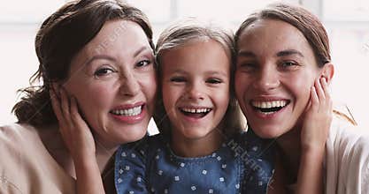 Close up portrait of happy beautiful three female generations family.