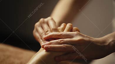 Professional foot massage close up.