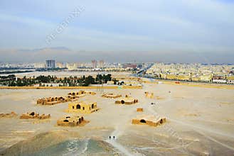 Tourists walking around Zoroastrian Towers of Silence, YAZD, IRAN