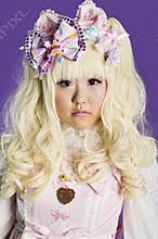 Portrait of japanese cosplayer wearing pink dress