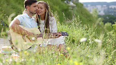 Young Couple In Love On Date Outdoors
