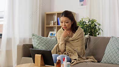 Sick woman having video call on tablet pc at home