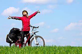 Happy young girl on mountain bike