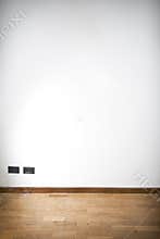 Empty room with wooden parquet