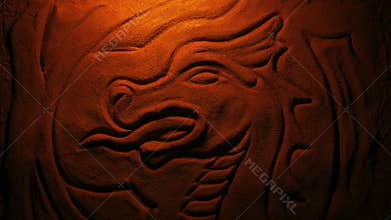 Carved stone dragon in fire glow