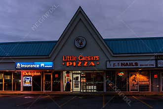 SURREY, CANADA - SEPTEMBER 23, 2019: Group of strip mall stores little caesars pizza.
