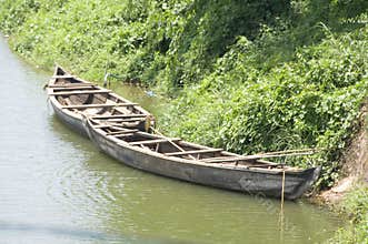 Wooden boats on river banks