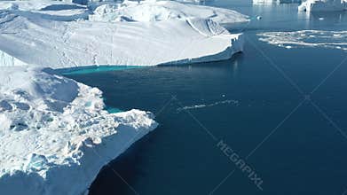 4K Aerial Drone shot of Iceberg and ice from glacier in arctic nature landscape on Greenland. Aerial video drone footage