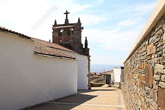 Church with belfry in the village Babe, Portugal
