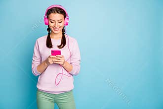 Portrait of her she nice attractive lovely cheerful cheery glad girl listening music free time isolated over bright