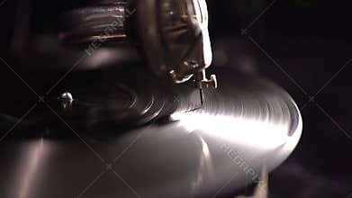 Atmospheric vintage music device. Gramophone needle on a rotating playing disc