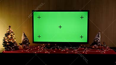 Christmas TV with green screen composited. TV or television - green screen - room - on the table. Christmas time