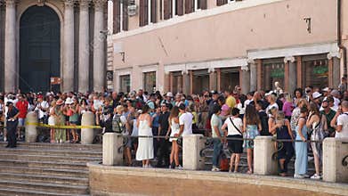 Rome, Italy - 5 September 2023. Closeup crowd of sightseeing tourists standing on Piazza di Trevi visiting Trevi