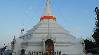 Beautiful white temple pagoda with people in Thailand. Stupa of Mae Hong Son
