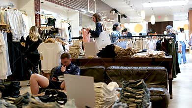 aritzia shopping for clothes stress relief joy happiness smile girls choosing clothes in a store shopping joy luck