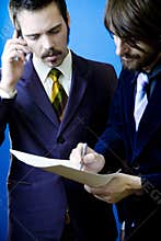 Businessmen inking a deal