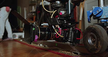 Close-up of a movie camera on Dolly's cart. The video production industry.