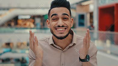 Portrait close up emotional happy shocked amazed wonder enthusiastic surprised shock amaze Indian Hispanic ethnic man