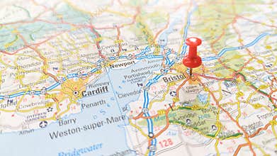A red pin stuck in Bristol on a map of England