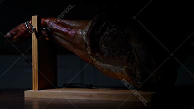 Jamon appears from darkness.