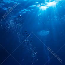 Underwater sunlight with air bubbles