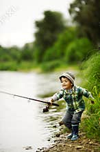 Photo of little boy fishing