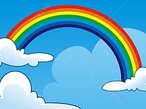 Rainbow between two Clouds on Clear Blue Sky