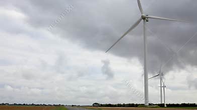 Winturbines in a field during autumn