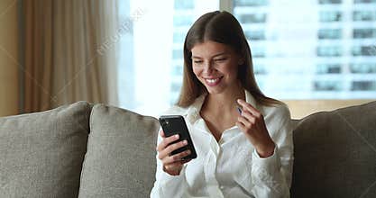 Happy beautiful female enjoy easy comfort e-shopping at home