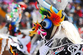 Dancers in typical costumes of devils, angels, Chinese and brunettes celebrate the festival of the Virgen de la Candelaria.