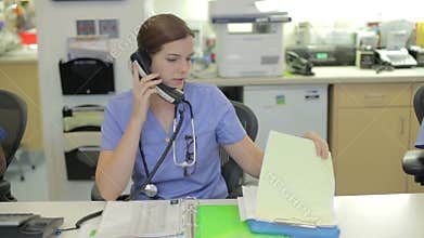 Medical Staff Working At Nurses Station