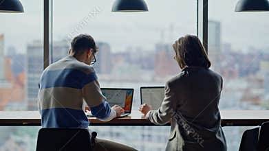 Joyful teammates working panoramic coworking closeup. Man woman typing laptops