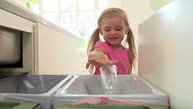 Slow Motion Sequence Of Girl Recycling Kitchen Waste In Bin