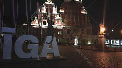 House of the Blackheads and Riga Sign at Night in Riga, Latvia