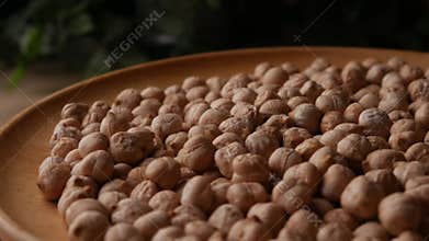 Raw Chickpeas on a rustic wooden table. Dry chickpea background close up.