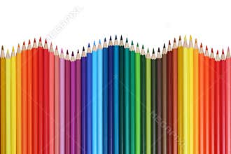 School supplies colored pencils forming a wave