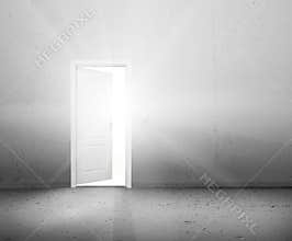 Open door to a new better world, the sun light shining through doorway