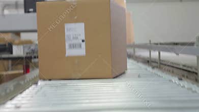 Point Of View Shot Of Box Moving Along Belt