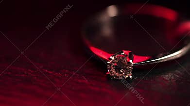 Diamond ring in red light.