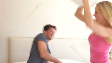 Husband and wife bouncing on