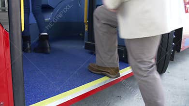 Close Up View Of Passenger's Feet Boarding Bus