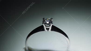 The shimmer of a diamond when exposed to light.