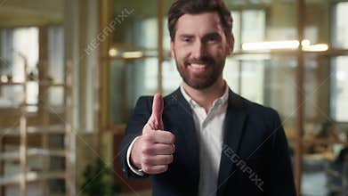 Happy business man looking at camera thumb up sign in office businessman raise finger good recommend company working